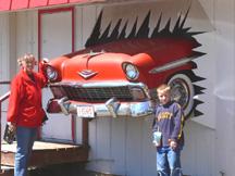 A '57 Chev protruding from Bliss' Bar and Grill